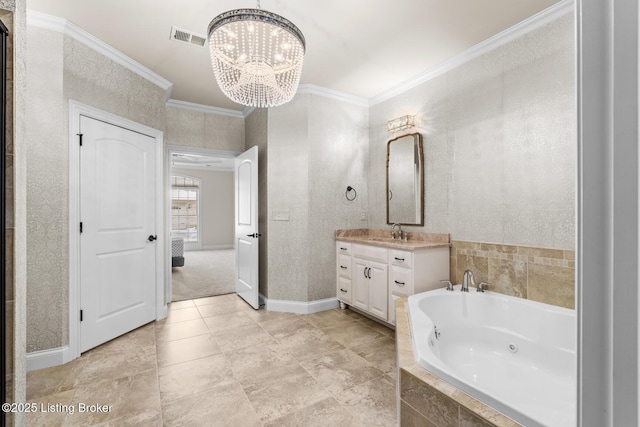 bathroom with crown molding, vanity, tiled tub, and a notable chandelier