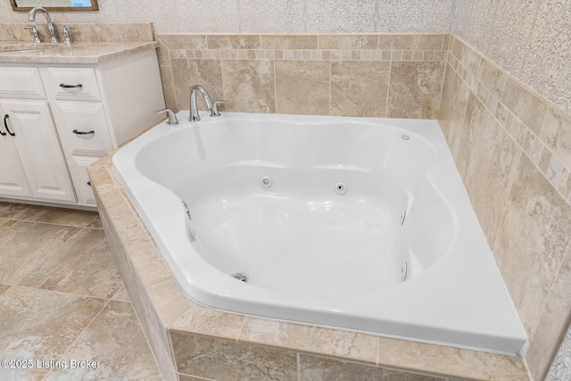 bathroom with a relaxing tiled tub and vanity