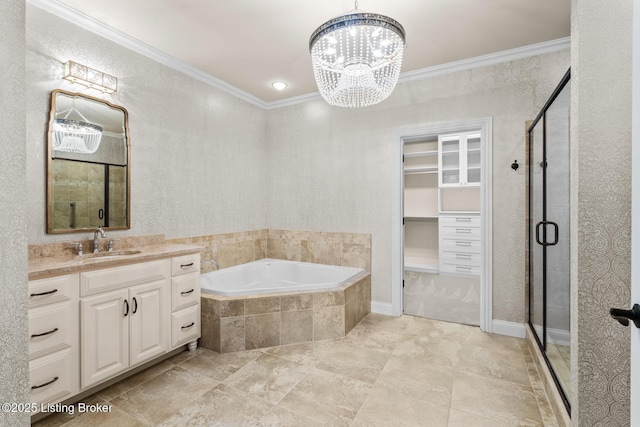 bathroom with vanity, ornamental molding, plus walk in shower, and a chandelier