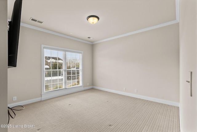 carpeted spare room with crown molding