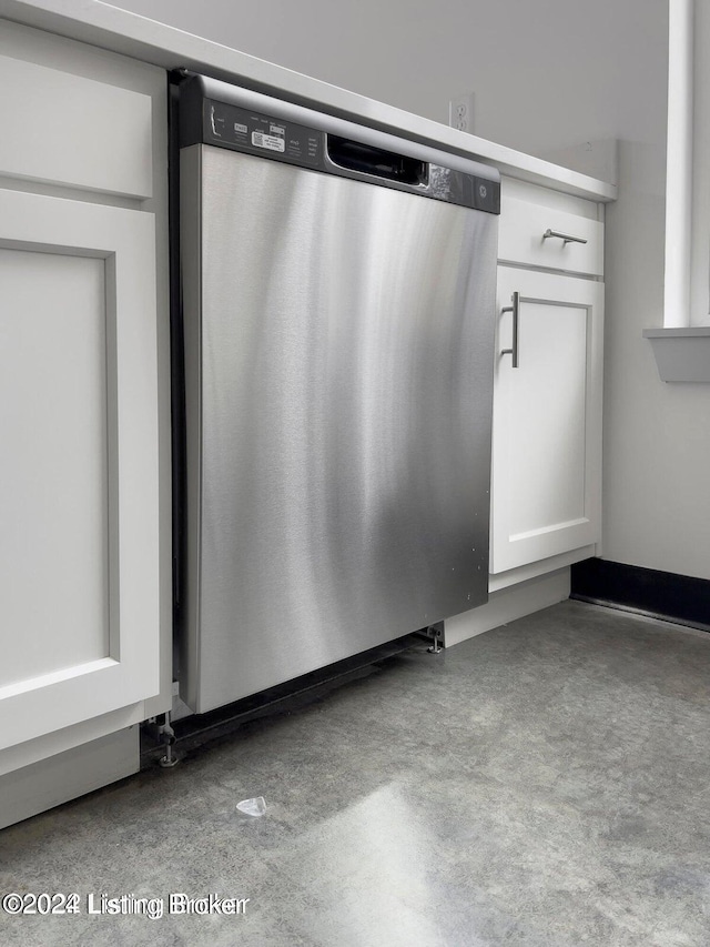 interior details with white cabinetry and dishwasher