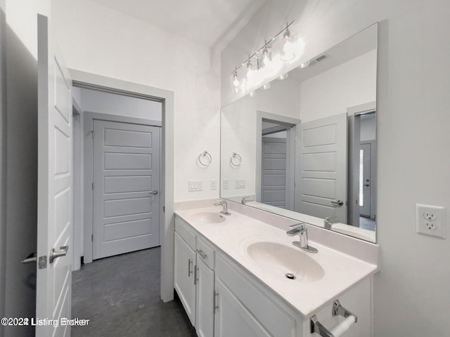 bathroom featuring concrete floors and vanity