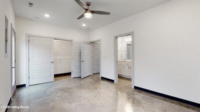 unfurnished bedroom with ceiling fan, ensuite bath, a closet, and concrete floors