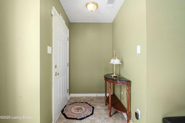 entrance foyer with a textured ceiling