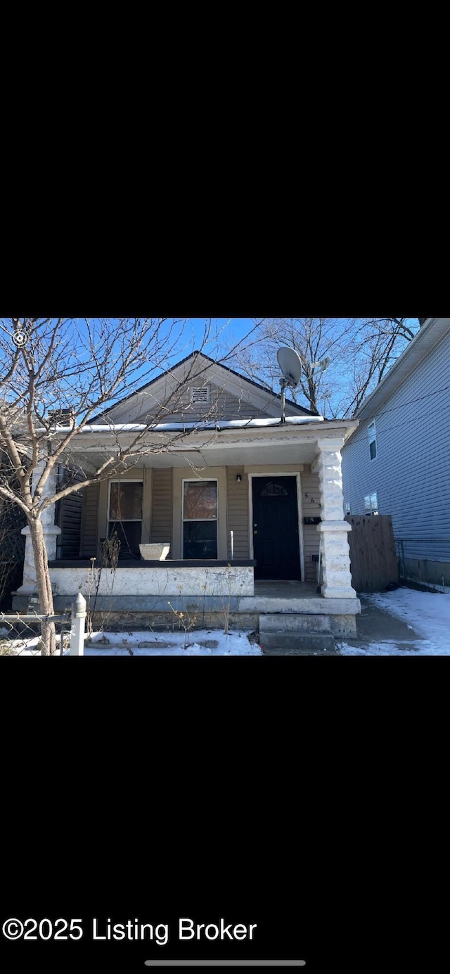 view of snow covered property entrance