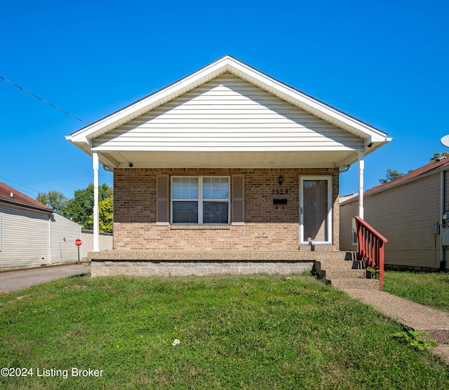 bungalow with a front yard