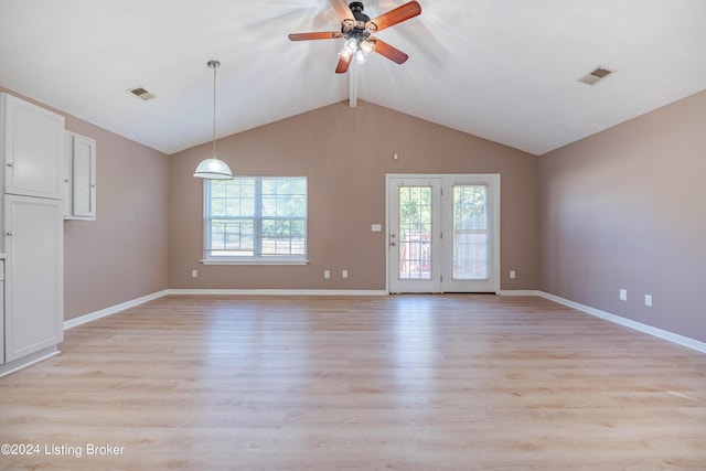 unfurnished living room with light wood-type flooring, vaulted ceiling, and ceiling fan