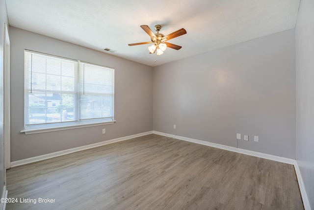 unfurnished room with light hardwood / wood-style floors and ceiling fan