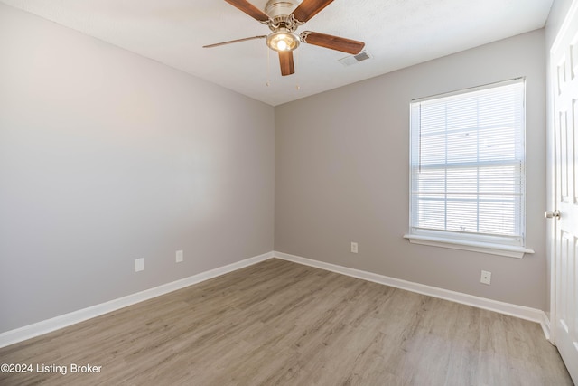 unfurnished room featuring ceiling fan and light hardwood / wood-style flooring