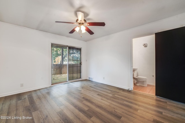 unfurnished room with wood-type flooring and ceiling fan