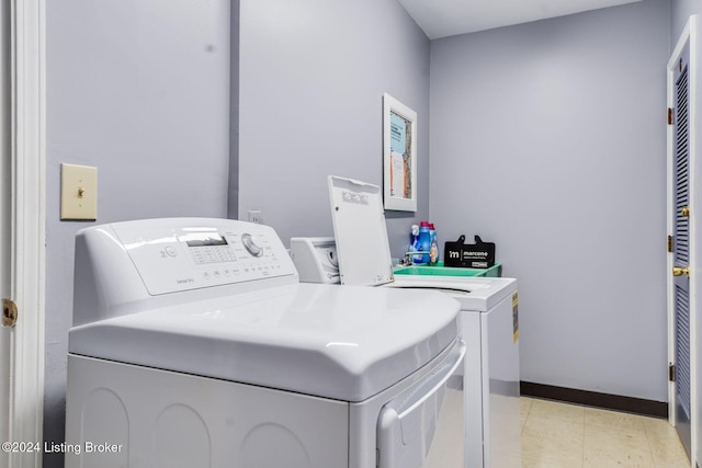 laundry area with washing machine and clothes dryer