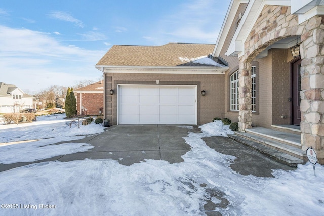 view of snow covered garage