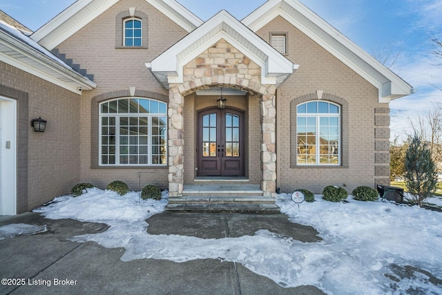 view of snow covered property entrance