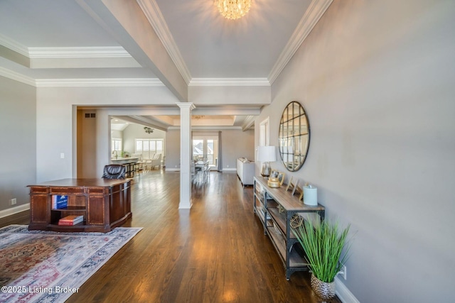 interior space featuring decorative columns, a chandelier, crown molding, and dark hardwood / wood-style flooring