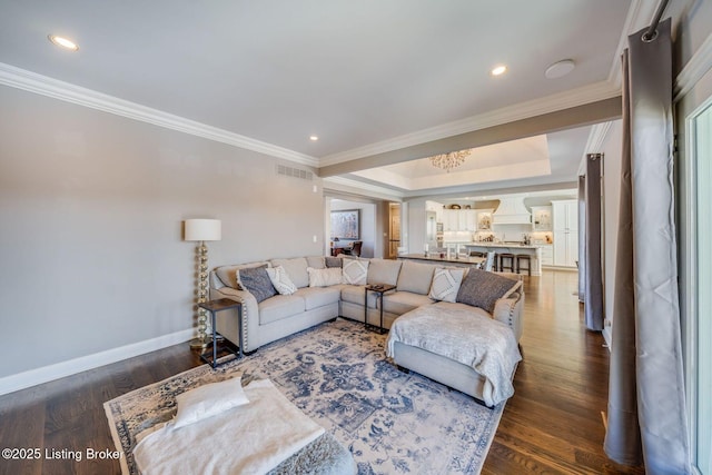 living room featuring dark hardwood / wood-style flooring and ornamental molding