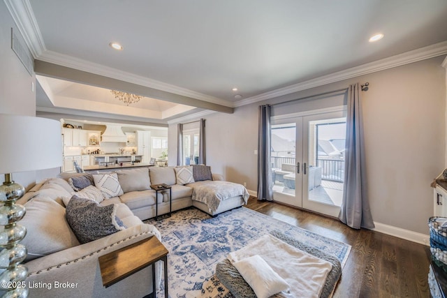 living room with dark wood-type flooring, crown molding, french doors, and a healthy amount of sunlight