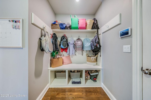 mudroom with a mail area and hardwood / wood-style floors