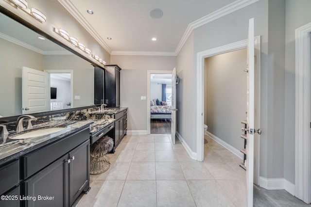 bathroom with crown molding, toilet, tile patterned floors, and vanity