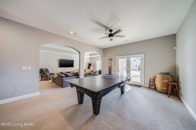 playroom featuring ceiling fan, light colored carpet, and french doors