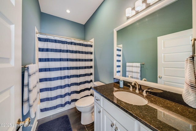 full bathroom featuring toilet, shower / tub combo with curtain, tile patterned floors, and vanity