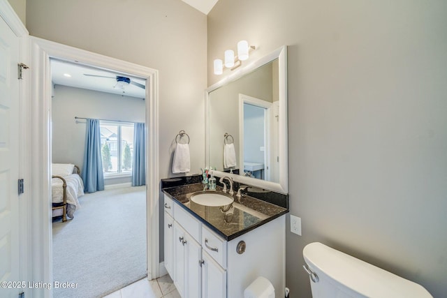 bathroom featuring toilet, tile patterned floors, and vanity