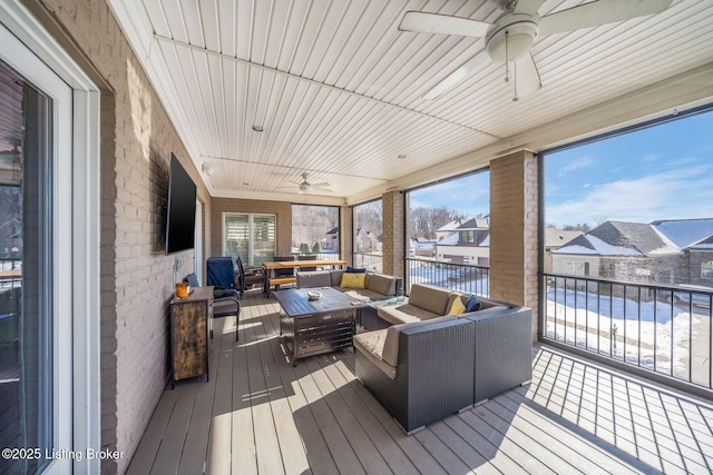 wooden deck featuring ceiling fan and outdoor lounge area