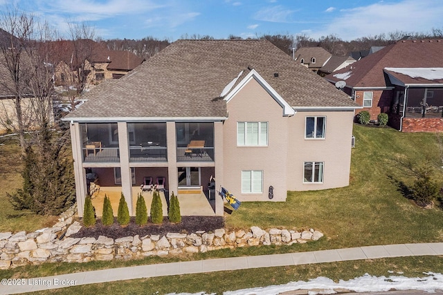 back of house with a patio area and a yard