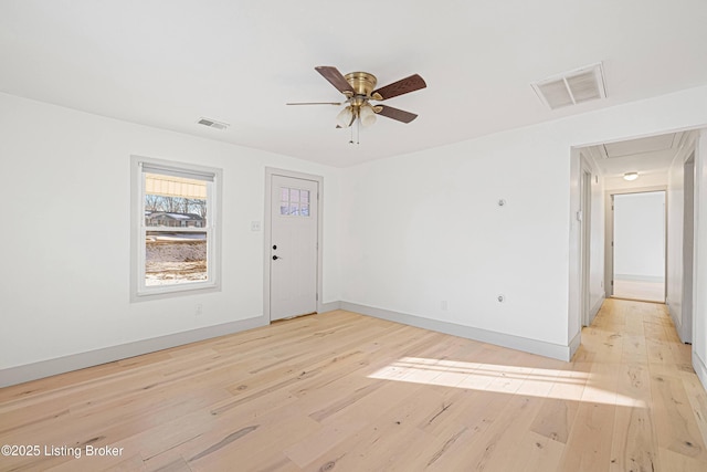 spare room with light hardwood / wood-style floors and ceiling fan