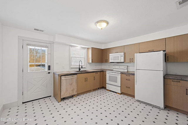 kitchen with sink and white appliances