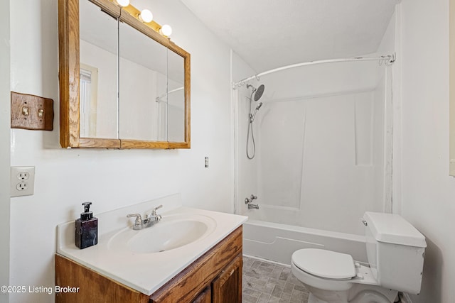 full bathroom featuring bathing tub / shower combination, toilet, and vanity