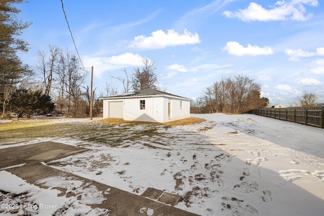 exterior space with a garage and an outdoor structure