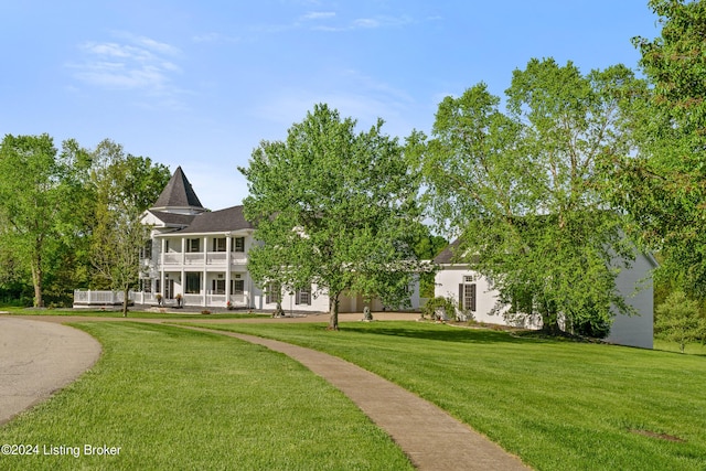 view of community featuring a lawn