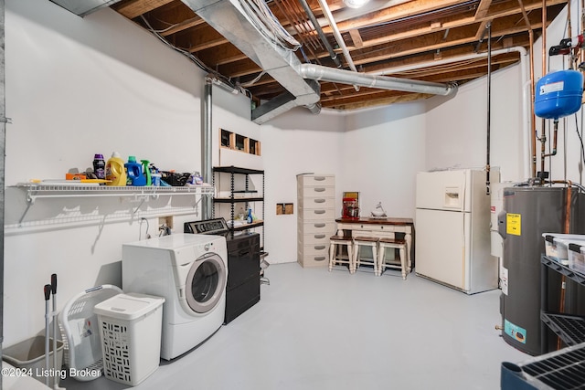 laundry area featuring washer and clothes dryer and electric water heater