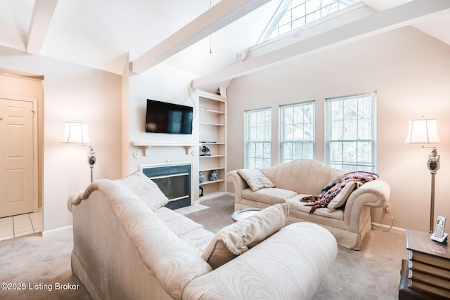 living room featuring built in shelves, high vaulted ceiling, beamed ceiling, and light carpet