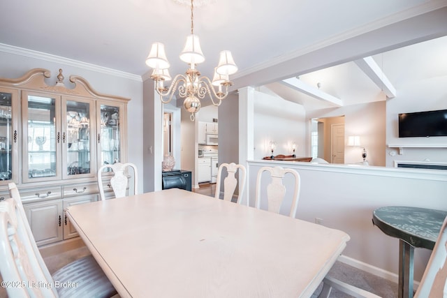 dining room with a chandelier and crown molding