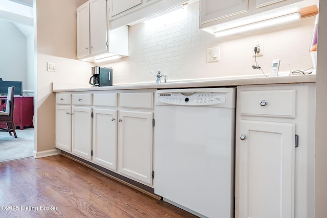 kitchen with light hardwood / wood-style floors, white cabinetry, decorative backsplash, and dishwasher