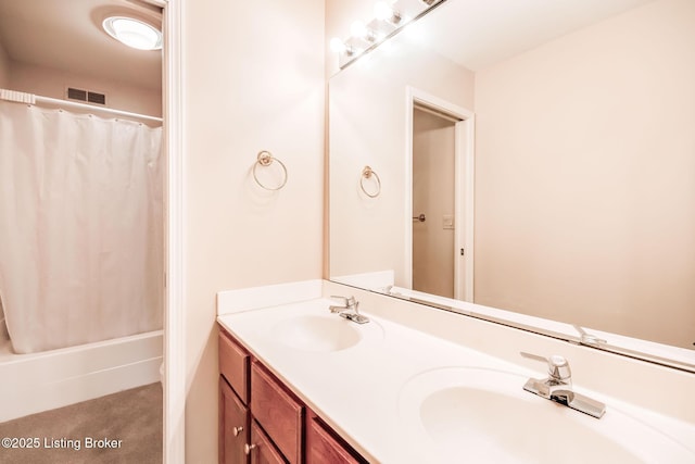 bathroom featuring vanity and shower / tub combo with curtain