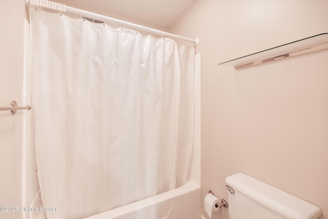 bathroom featuring toilet and shower / bath combo with shower curtain