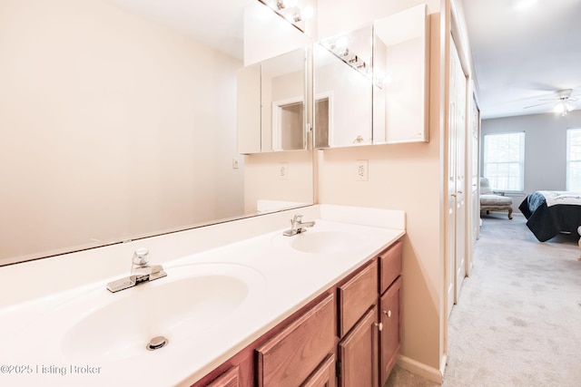 bathroom with ceiling fan and vanity