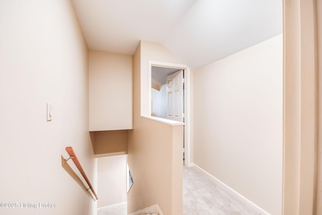 interior space with carpet and lofted ceiling