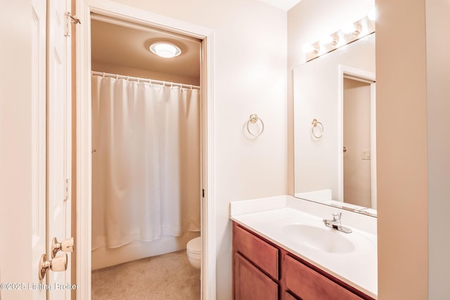 full bathroom featuring shower / bath combo with shower curtain, toilet, and vanity