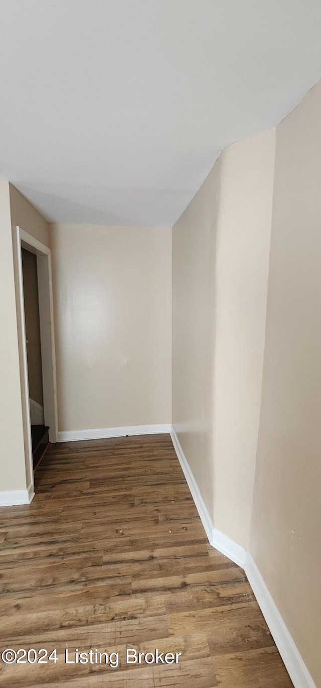 empty room featuring hardwood / wood-style flooring