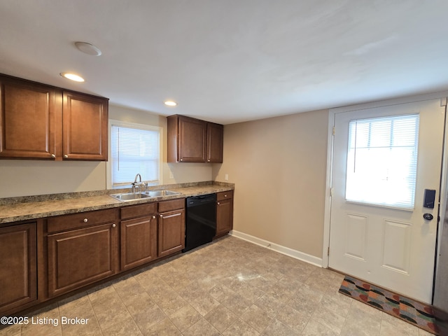 kitchen featuring recessed lighting, baseboards, dishwasher, and a sink