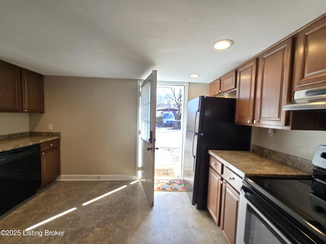 kitchen featuring ventilation hood, baseboards, and black appliances