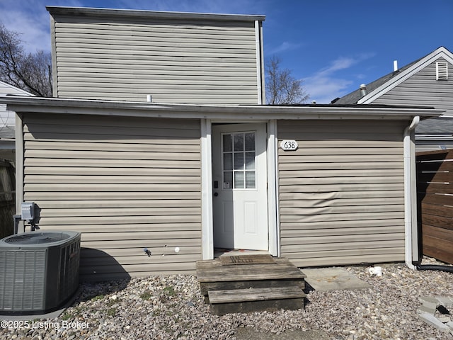 property entrance with central AC unit