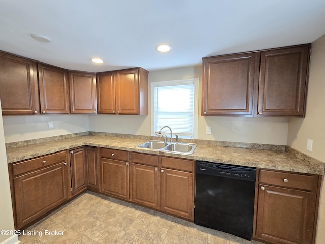 kitchen featuring black dishwasher, a sink, and recessed lighting