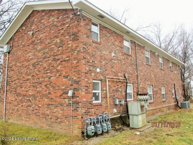 view of side of home with cooling unit