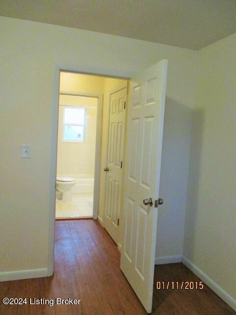 corridor featuring hardwood / wood-style flooring