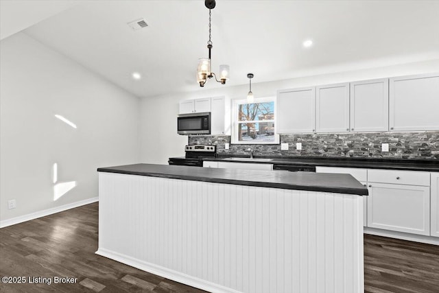 kitchen featuring a center island, hanging light fixtures, range with electric stovetop, dark hardwood / wood-style floors, and white cabinets