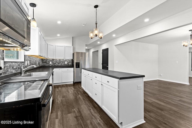 kitchen featuring an inviting chandelier, decorative light fixtures, and white cabinets